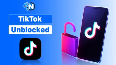 Gemini said An image featuring the TikTok logo on a smartphone screen next to an open pink padlock, with the bold text "TikTok Unblocked" and a blue circular "N" logo in the upper left corner, all set against a vibrant blue gradient background.