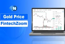 A laptop showing a live gold trading candlestick chart on a financial banner for nogentech.org.