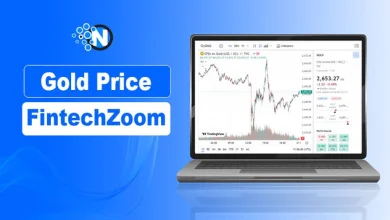 A laptop showing a live gold trading candlestick chart on a financial banner for nogentech.org.