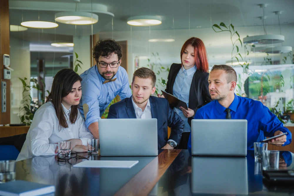 Team of 5 tech experts collaborating on a project