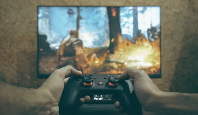 Hands holding a game controller playing a video game