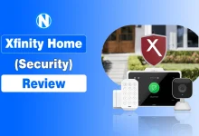 Xfinity Home Security Review graphic featuring a touchscreen control panel, indoor camera, keypad, and door sensor against a blue background.