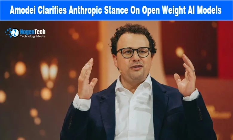 Anthropic CEO Dario Amodei speaking at a conference with hands raised.