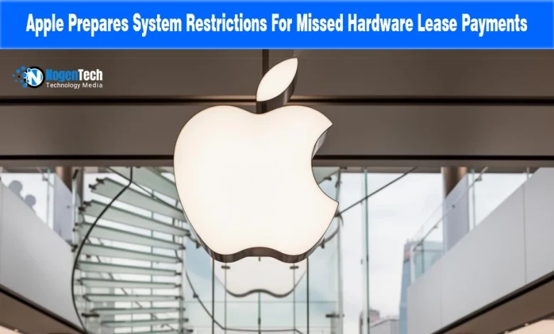 Illuminated Apple logo hanging inside a modern Apple Store above a glass staircase.