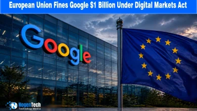 Large Google logo on a modern corporate glass building standing next to a flying European Union flag.