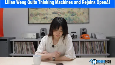 AI researcher Lilian Weng sitting at a desk with a white mug and phone.