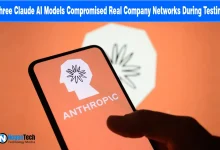 Hand holding a smartphone displaying the Anthropic logo in front of a screen with the same icon.