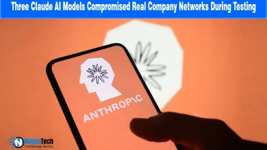 Hand holding a smartphone displaying the Anthropic logo in front of a screen with the same icon.