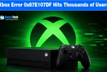 Black Xbox console and controller resting in front of a glowing green Xbox logo.