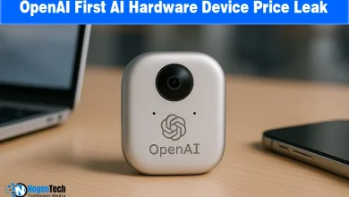 Compact metallic OpenAI hardware device with a camera lens resting on a desk.