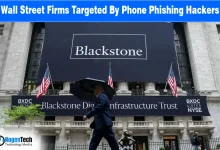 Exterior view of a Wall Street financial institution featuring a large Blackstone building banner.