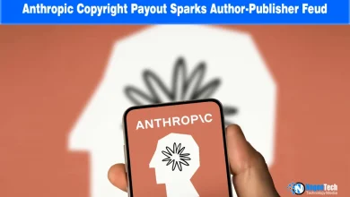 Hand holding a smartphone displaying the Anthropic logo over a warm background.