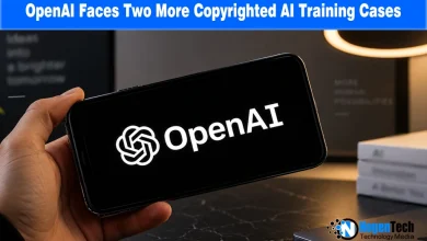 Smartphone displaying the white OpenAI logo on a dark screen held over a desk.