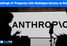 Silhouetted figures in front of a large illuminated Anthropic logo wall display.