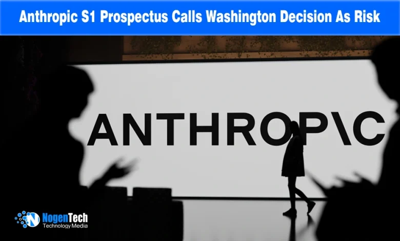 Silhouetted figures in front of a large illuminated Anthropic logo wall display.
